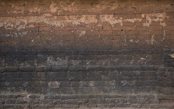 Antigua pared de ladrillo: Textura de ladrillo vintage oscuro — Foto de Stock