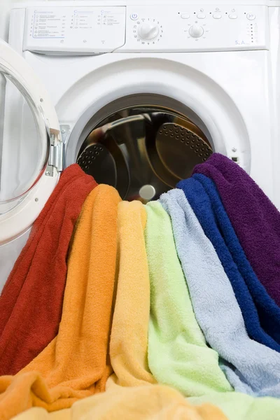 Washing machine and colorful laundry to wash — Stock Photo, Image