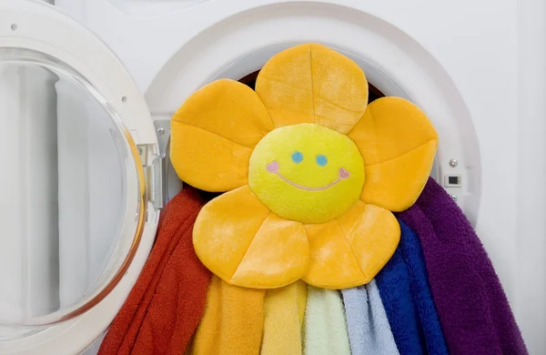 Washing machine, toy and colorful laundry to wash — Stock Photo, Image