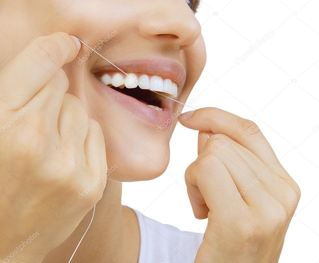 Woman and teeth floss 