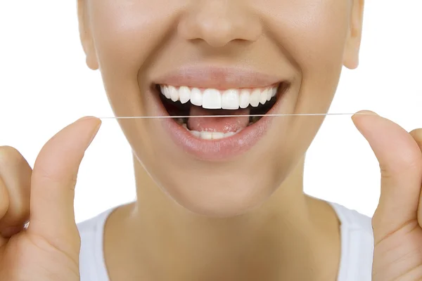 Mujer y dientes hilo dental — Foto de Stock