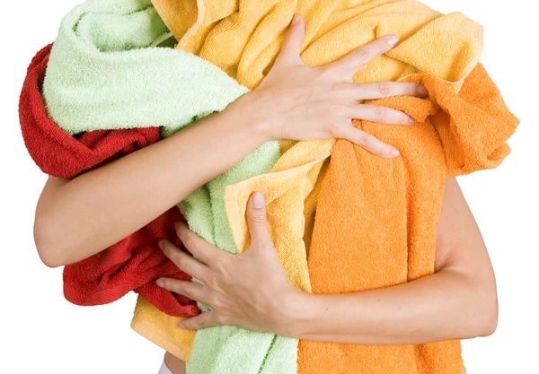 Mulher segurando um monte de roupa colorida em suas mãos, Isolado o — Fotografia de Stock