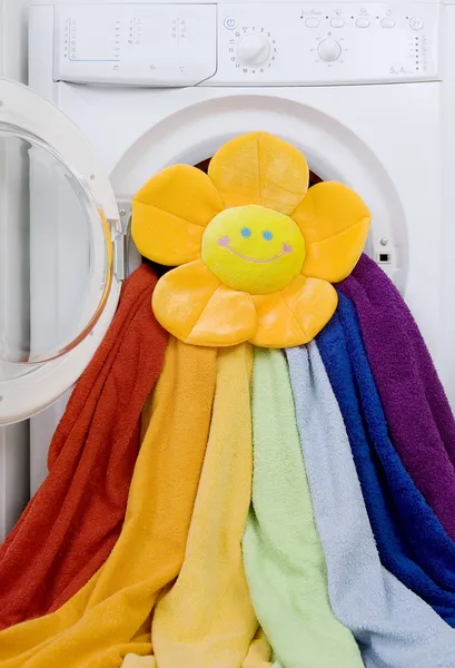 Washing machine, toy and colorful laundry to wash — Stock Photo, Image