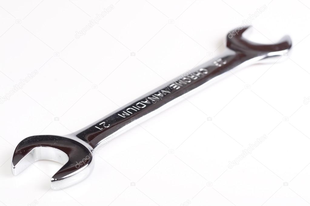 Metal wrench isolated on white background.