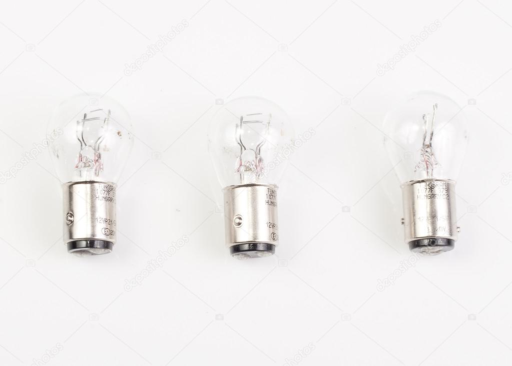 Three light bulbs lying next to each other.