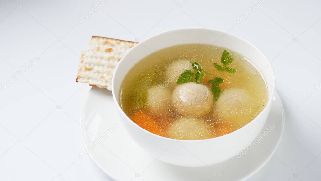 Jewish chicken broth with kneidlach (balls made with matzo meal)Matzo ball soup
