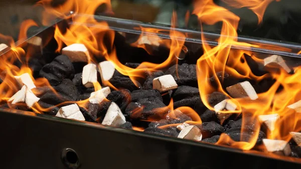 Empty Barbecue Flaming Grill Close Bright Flames White Firelighters Burning — Stok fotoğraf