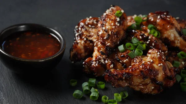 Grilled Chicken Wings Sauce Garnished Green Onions Slate Board Black — Stock Fotó