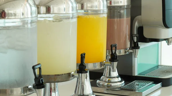 Hotel beverages dispensers. Drinking water, lemonade, orange juice.