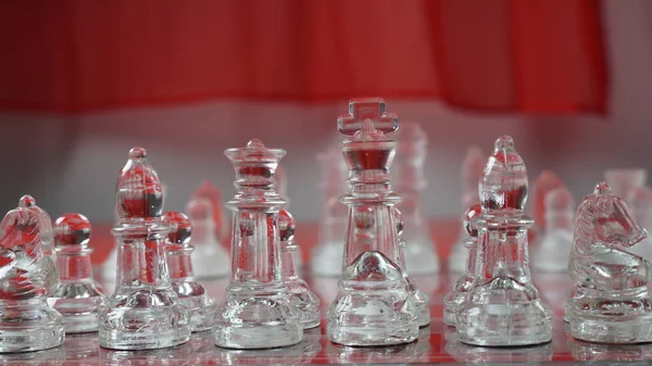 Transparent Chess Figures Starting Position Reflective Chess Board Red Tone — Stock Photo, Image