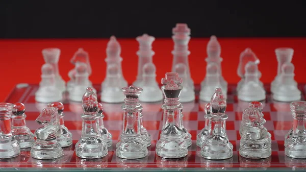 Transparent Chess Figures Starting Position Reflective Chess Board Red Tone — Stock Photo, Image