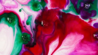 Abstract colors, backgrounds and textures. Oil coloring in milk creating bright colorful abstract backgrounds. Chemical experiment.