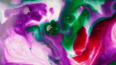 Abstract colors, backgrounds and textures. Oil coloring in milk creating bright colorful abstract backgrounds. Chemical experiment.