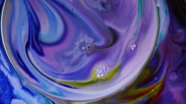 Abstract colors, backgrounds and textures. Oil coloring in milk creating bright colorful abstract backgrounds. Chemical experiment.