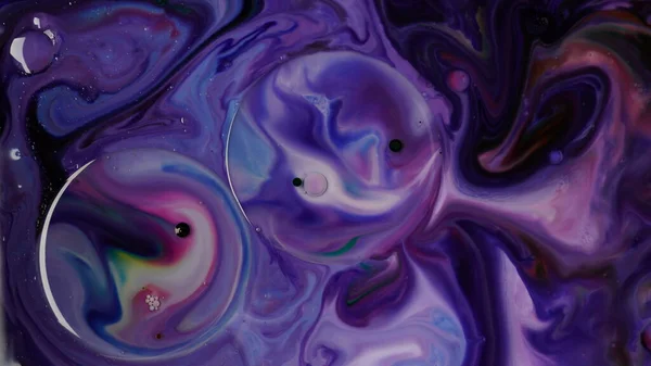 Abstract colors, backgrounds and textures. Oil coloring in milk creating bright colorful abstract backgrounds. Chemical experiment.