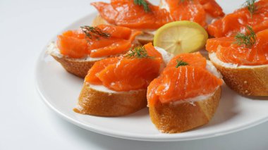 Open sandwiches with trout fillet ,wheat bread with butter and herbs
