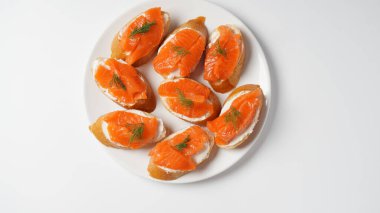 Open sandwiches with trout fillet ,wheat bread with butter and herbs