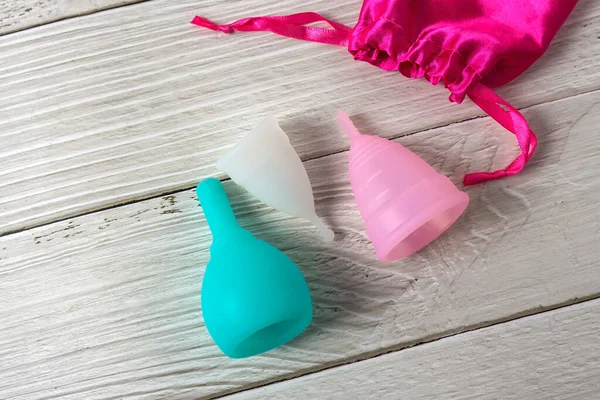 Menstrual silicone cups different colors, shapes and capacity for menstruation cycle. Sustainable and comfortable menstruation cycle periods. Reusable eco friendly and zero waste hygiene products — Stock Photo, Image