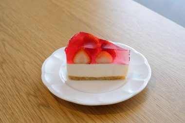 strawberry jelly cheesecake on white plate.Homemade bakery concept.