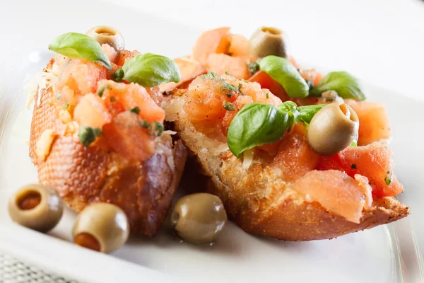 Bruschetta with mozzarella and tomato — Stock Photo, Image