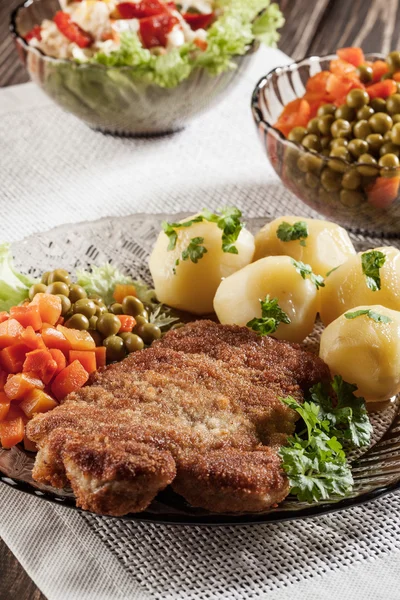 Breaded chop and potatoes — Stock Photo, Image