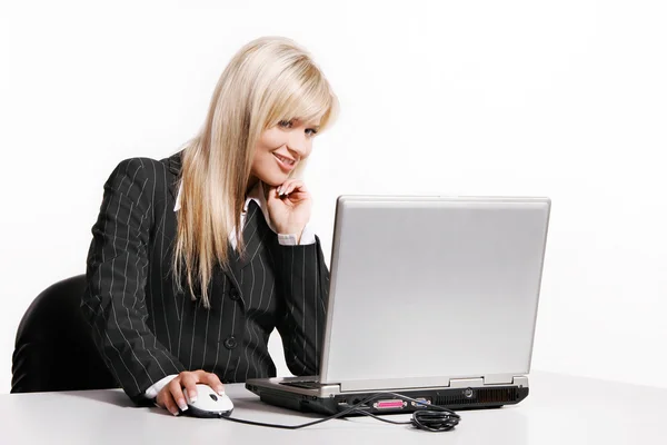 Beautiful young woman working with laptop — Stock Photo, Image