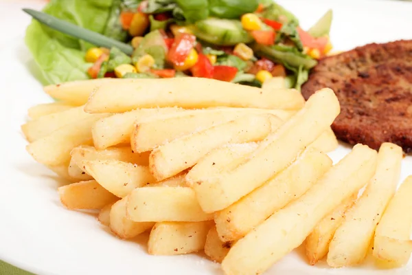 French fries and salad — Stock Photo, Image