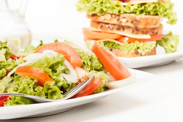 Salad and sandwiches — Stock Photo, Image