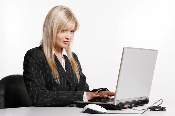 Beautiful young woman working with laptop — Stock Photo, Image