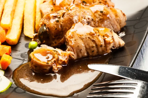 Beef rolls with french fries — Stock Photo, Image