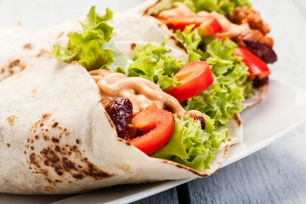 Burrito. Tortilla with meat and beans — Stock Photo, Image