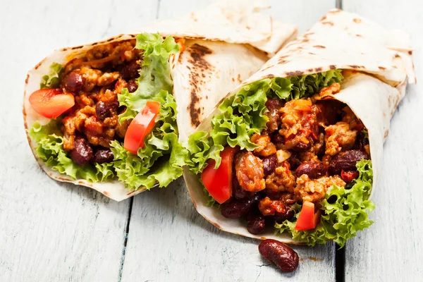 Burrito. Tortilla with meat and beans — Stock Photo, Image