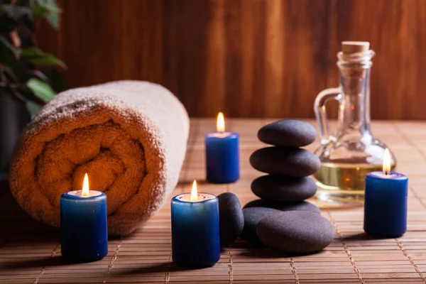 Spa still life with hot stones and candles — Stock Photo, Image