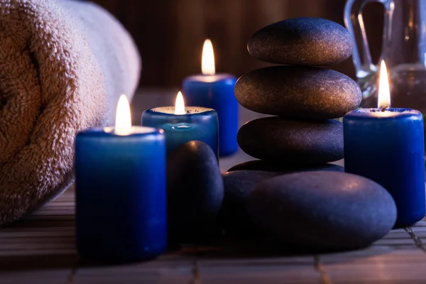 Spa still life with hot stones essential oil and candles — Stock Photo, Image