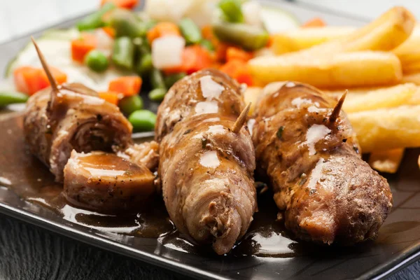 Pork rolls with french fries — Stock Photo, Image