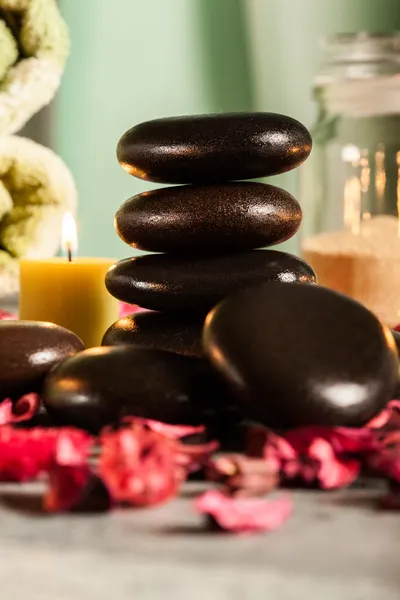 Spa still life with hot stones and candles — Stock Photo, Image