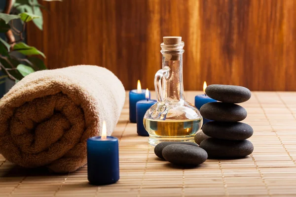 Spa still life with hot stones and candles — Stock Photo, Image