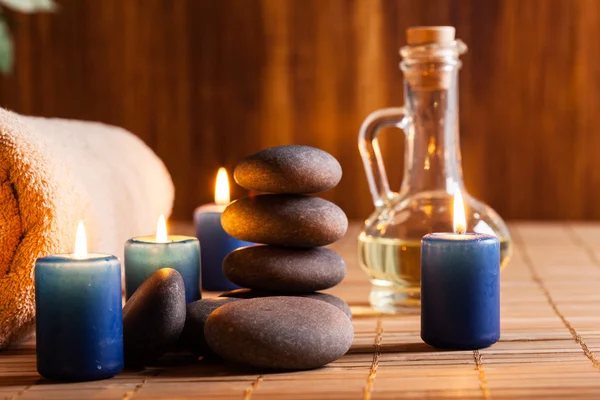 Spa still life with hot stones and candles — Stock Photo, Image