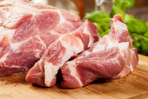 Raw pork on cutting board — Stock Photo, Image