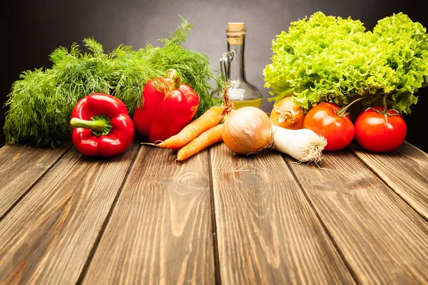 Vegetables on old wooden table Stock Photo