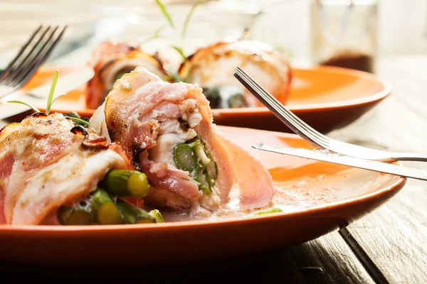 Baked asparagus wrapped in chicken and bacon — Stock Photo, Image