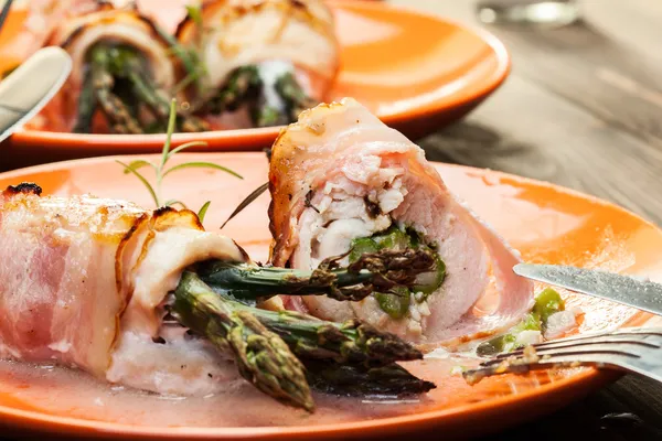 Baked asparagus wrapped in chicken and bacon — Stock Photo, Image