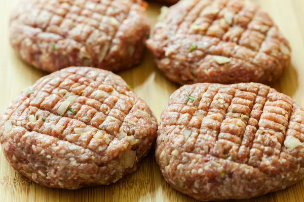 Hamburgers on cutting board — Stock Photo, Image