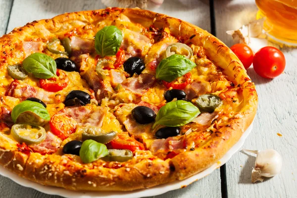 Pizza with bacon, olives and jalapeno pepper — Stock Photo, Image