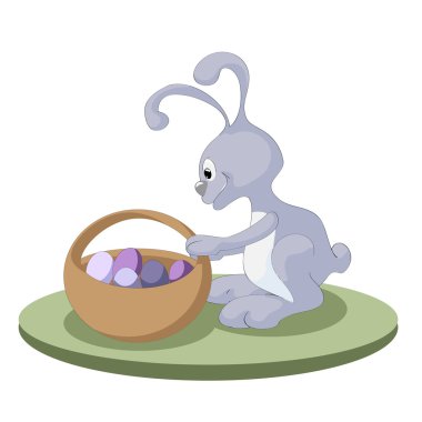 Paskalya tavşanı ve içi paskalya yumurtası dolu Paskalya sepeti.