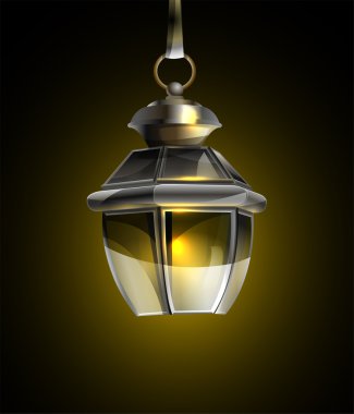 Old lamp on a black background clipart