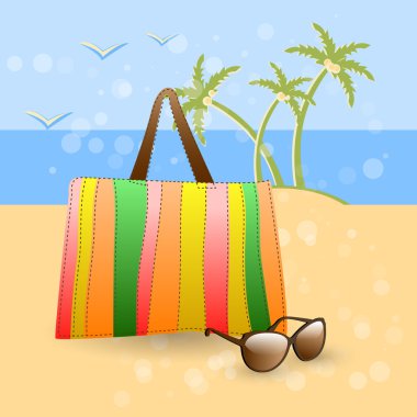 Summer at the beach - stylish accessories on golden sand at the beach: colorful bag and sunglasses. clipart