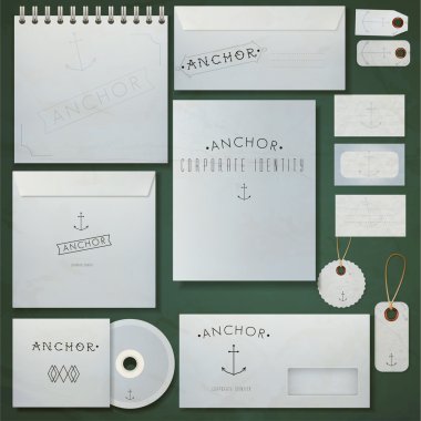 Set of paper envelopes, notebook and visiting cards with inscription 