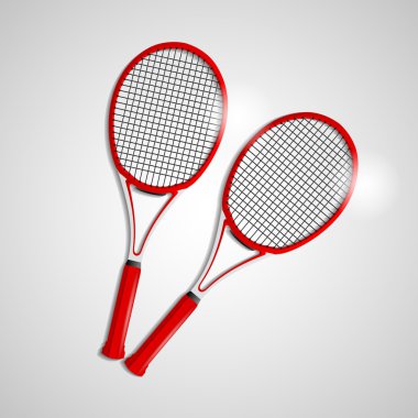 Red tennis rackets over gray background clipart