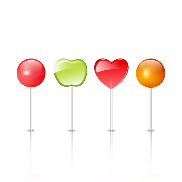 Red, yellow and green lollipops isolated on white background